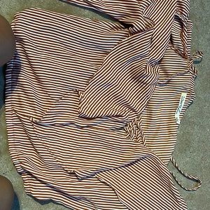 very good material , off the shoulder kind of , long sleeve , dressy like